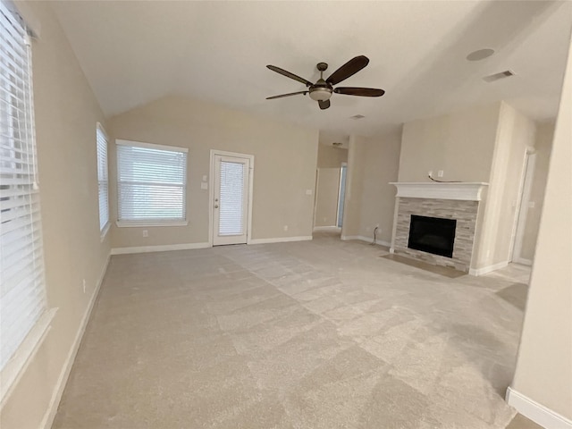 unfurnished living room with visible vents, baseboards, ceiling fan, a tiled fireplace, and light carpet