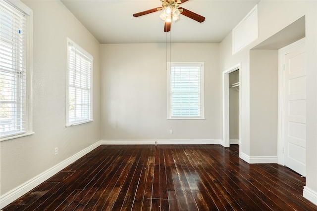 unfurnished bedroom with a ceiling fan, baseboards, and hardwood / wood-style floors