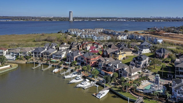 birds eye view of property with a residential view and a water view