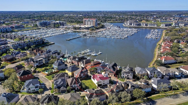 birds eye view of property featuring a water view and a residential view