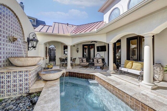 view of pool featuring a patio area, french doors, an outdoor hangout area, and a ceiling fan