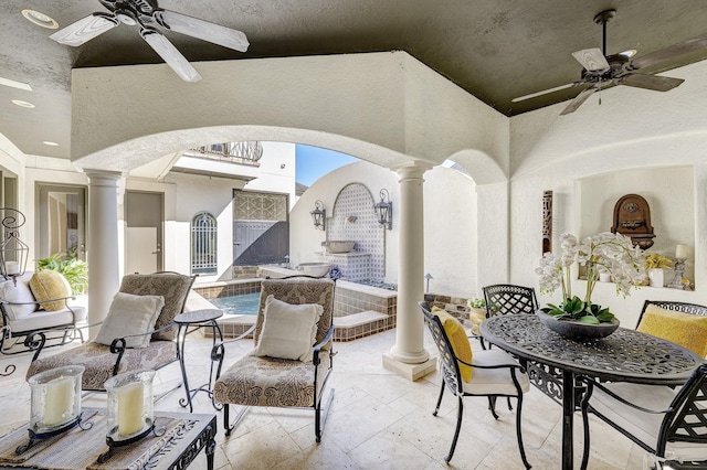 view of patio featuring a gate and ceiling fan