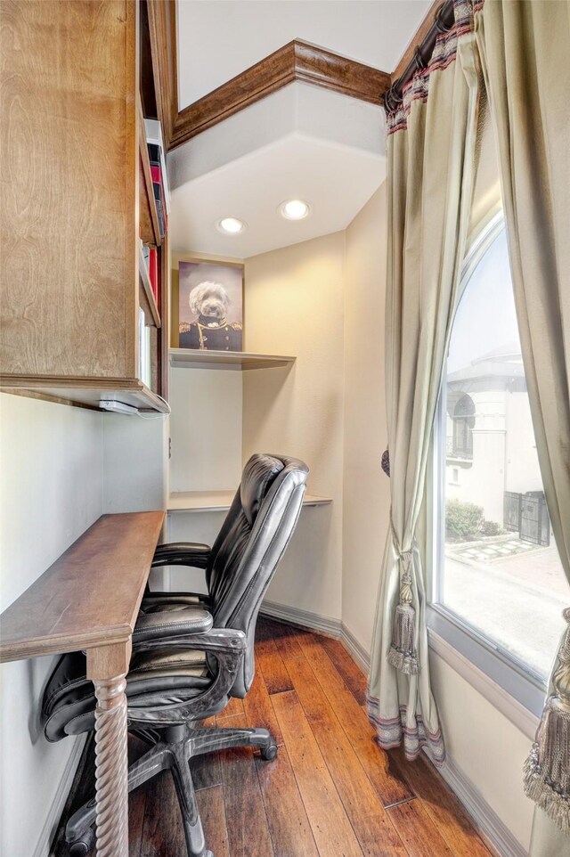 office space featuring baseboards and hardwood / wood-style floors