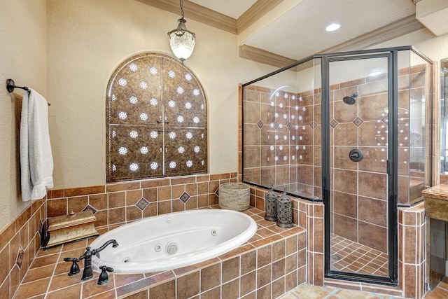 bathroom featuring a tub with jets, a stall shower, and crown molding