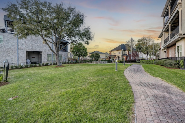 surrounding community featuring a yard and fence