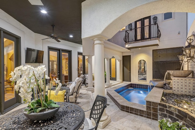 view of pool featuring ceiling fan, french doors, outdoor dining area, a patio area, and an in ground hot tub