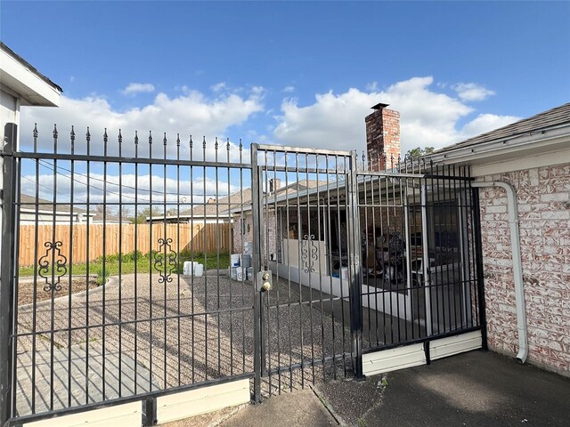 view of gate featuring fence