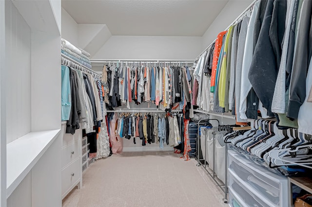 walk in closet featuring carpet