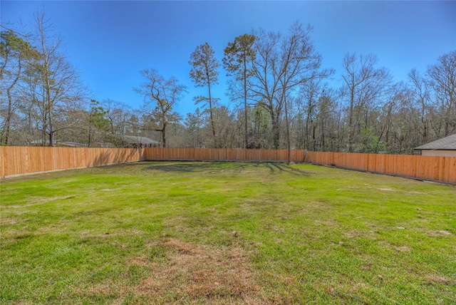 view of yard featuring a fenced backyard