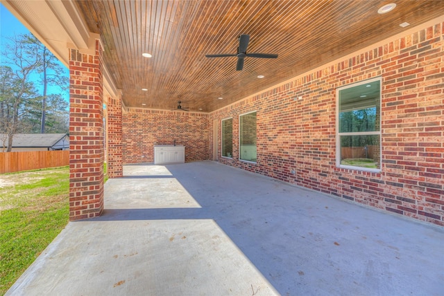 view of patio / terrace with a ceiling fan and fence