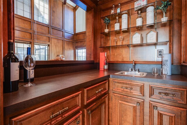 bar featuring wet bar and a sink