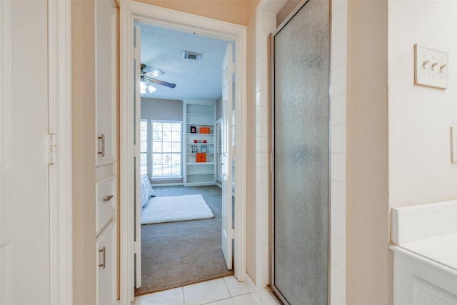 full bath featuring tile patterned floors, a stall shower, and ceiling fan