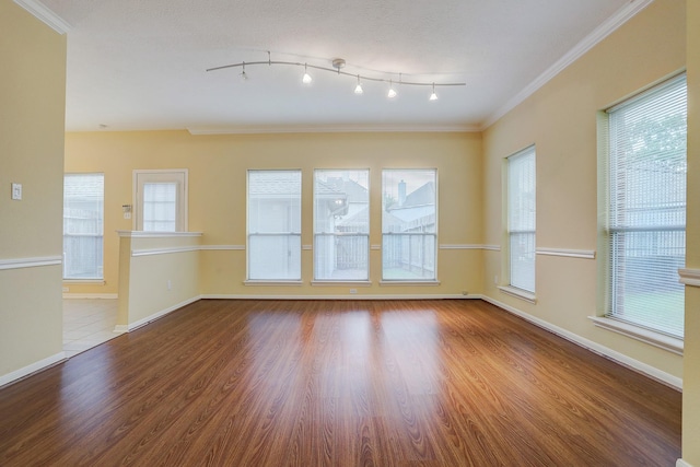 1373 El Camino Village Dr, Houston, TX 77058 - unfurnished room with plenty of natural light, ornamental molding, baseboards, and wood finished floors