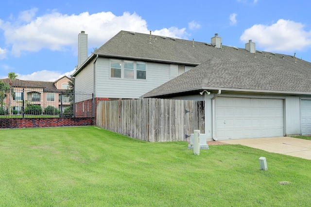 1373 El Camino Village Dr, Houston, TX 77058 - rear view of house featuring a lawn, driveway, fence, a shingled roof, and a chimney