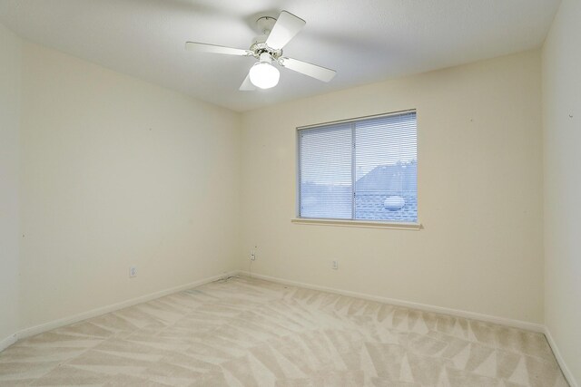 1373 El Camino Village Dr, Houston, TX 77058 - empty room featuring light colored carpet, baseboards, and ceiling fan