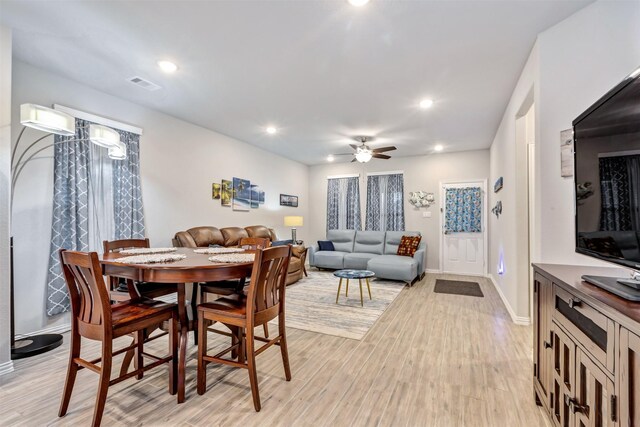 dining area featuring visible vents, baseboards, recessed lighting, light wood-style floors, and a ceiling fan