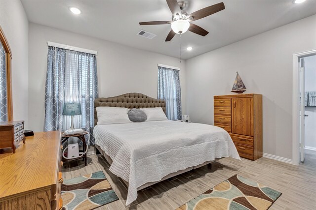 bedroom with visible vents, recessed lighting, light wood-style floors, baseboards, and ceiling fan