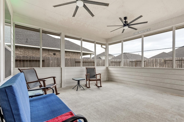 sunroom / solarium with visible vents and a ceiling fan