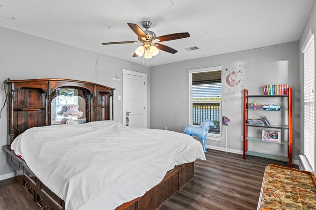 bedroom with visible vents, multiple windows, baseboards, and dark wood-style flooring