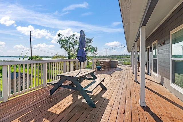 deck with outdoor dining area