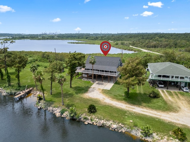 bird's eye view with a view of trees and a water view