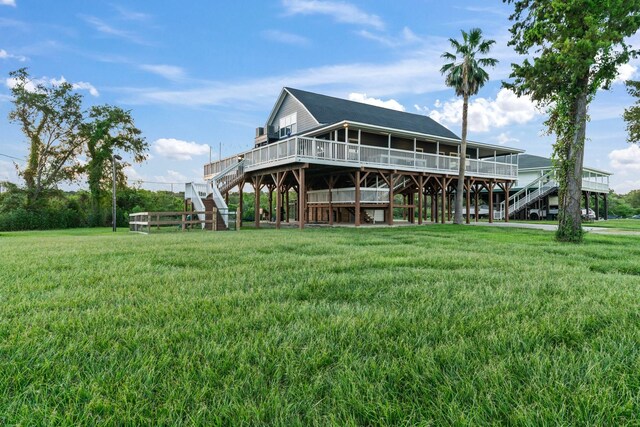 exterior space with stairway and a yard