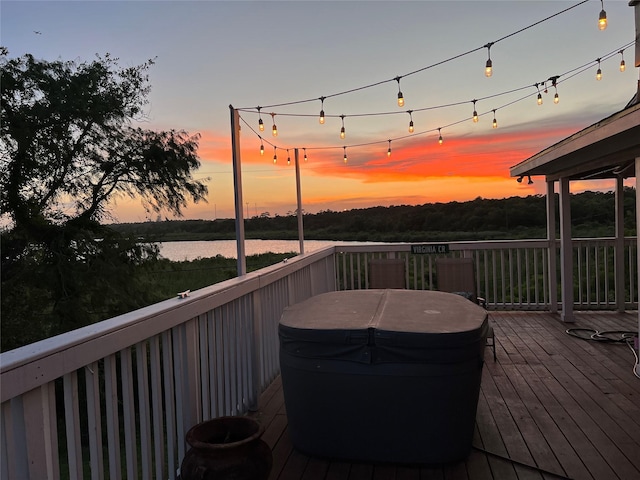 wooden deck featuring a water view