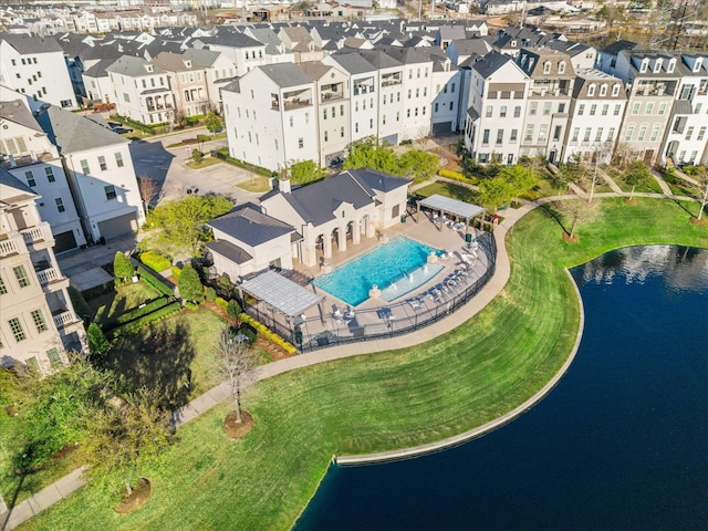 birds eye view of property featuring a water view and a residential view