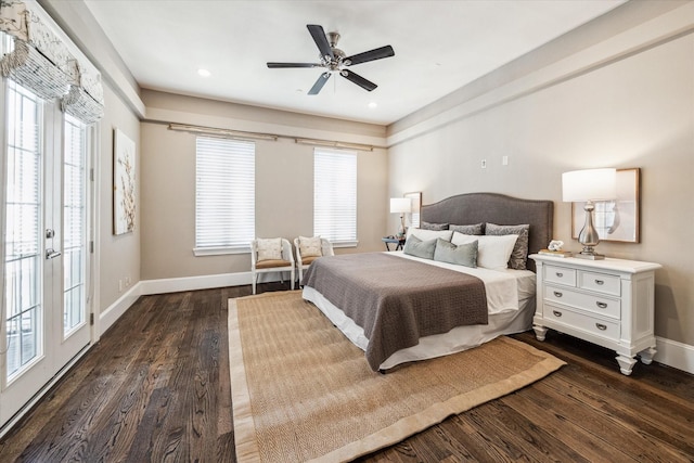 bedroom with multiple windows, baseboards, and dark wood-type flooring