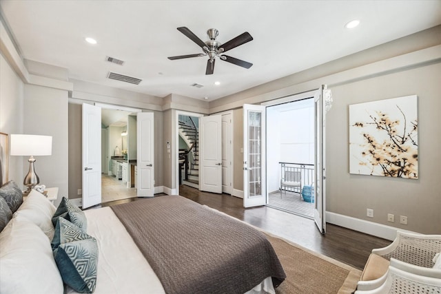 bedroom with visible vents, baseboards, wood finished floors, and access to exterior