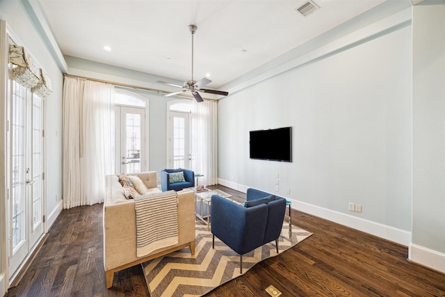 living area featuring visible vents, baseboards, dark wood-style floors, and french doors