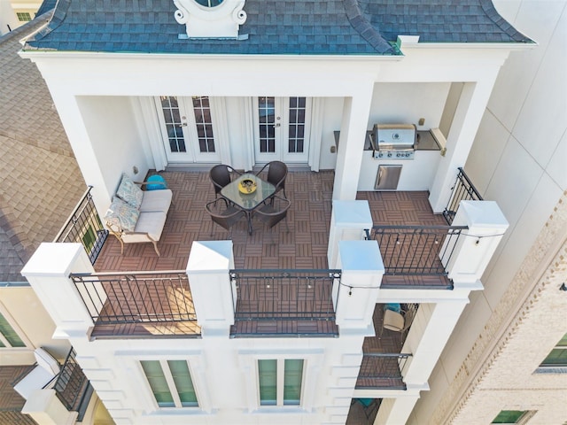 view of patio / terrace with outdoor lounge area, a balcony, area for grilling, and french doors