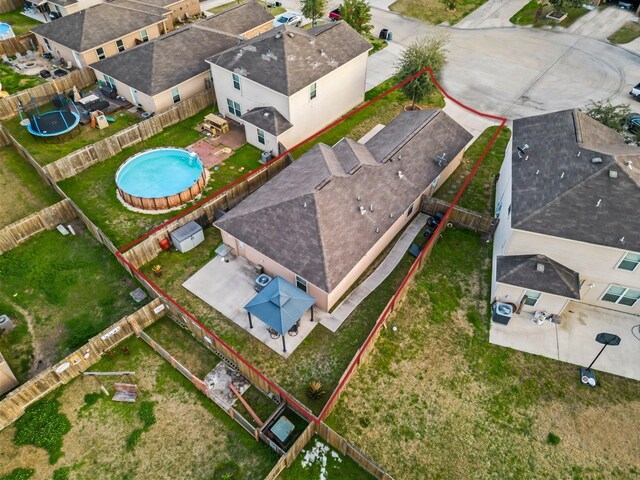 birds eye view of property with a residential view