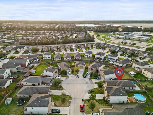 birds eye view of property with a residential view