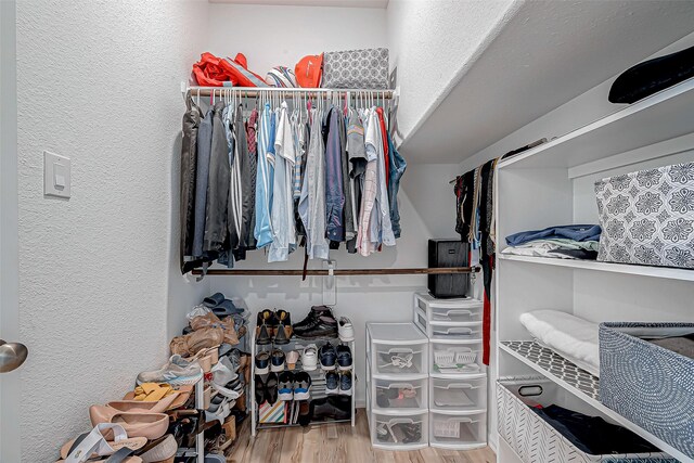 spacious closet featuring wood finished floors