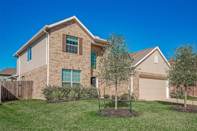 traditional-style house featuring driveway, a front lawn, fence, a garage, and brick siding