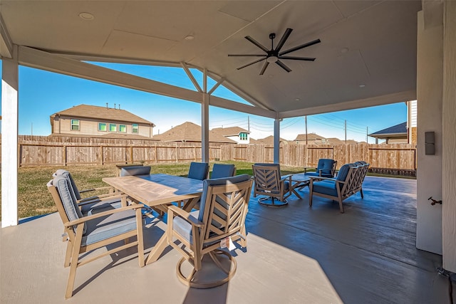 view of patio / terrace featuring outdoor dining area, a ceiling fan, and a fenced backyard