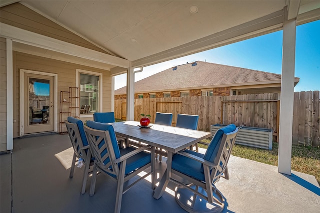 view of patio / terrace featuring outdoor dining space and fence