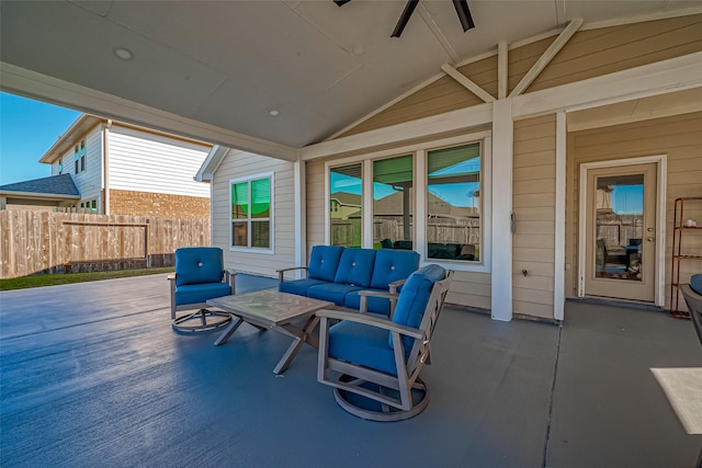 view of patio with fence and an outdoor hangout area