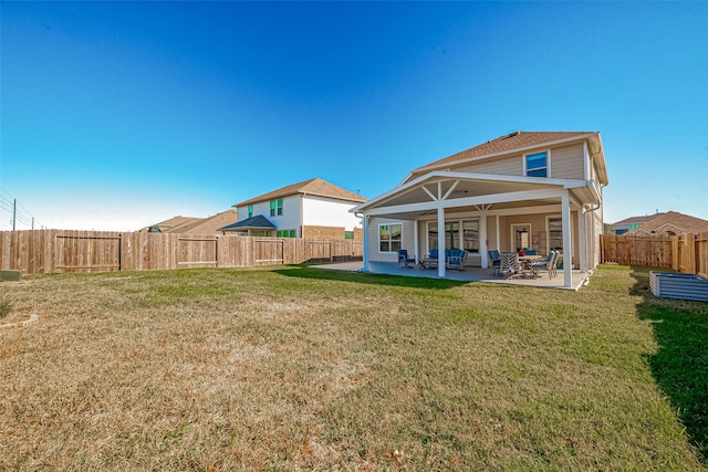 rear view of property with a patio area, a lawn, and a fenced backyard