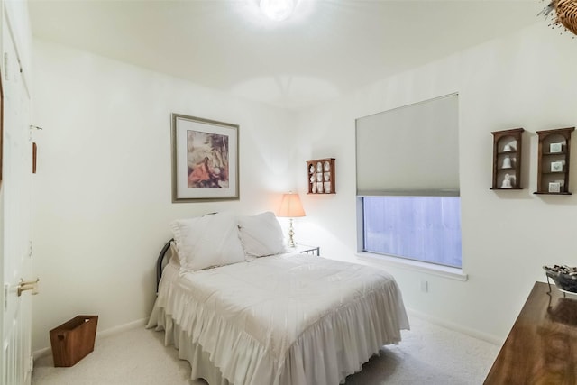 carpeted bedroom with baseboards