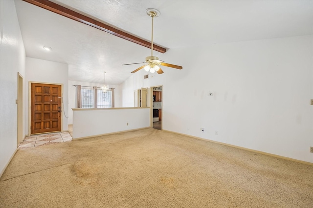 unfurnished living room with vaulted ceiling with beams, light colored carpet, baseboards, and ceiling fan