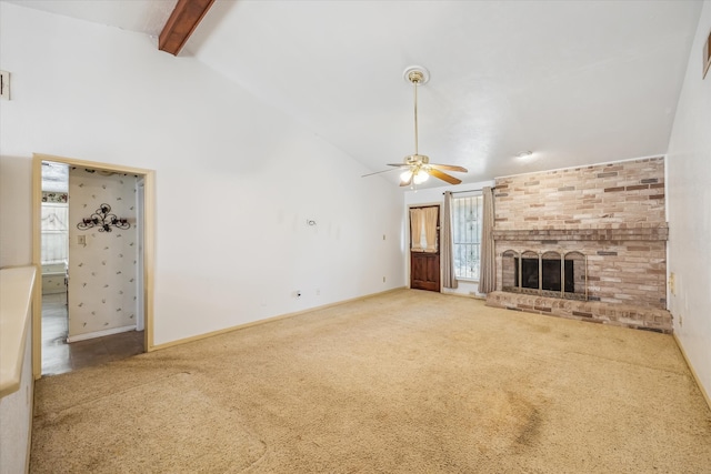 unfurnished living room with high vaulted ceiling, beam ceiling, carpet, and a fireplace