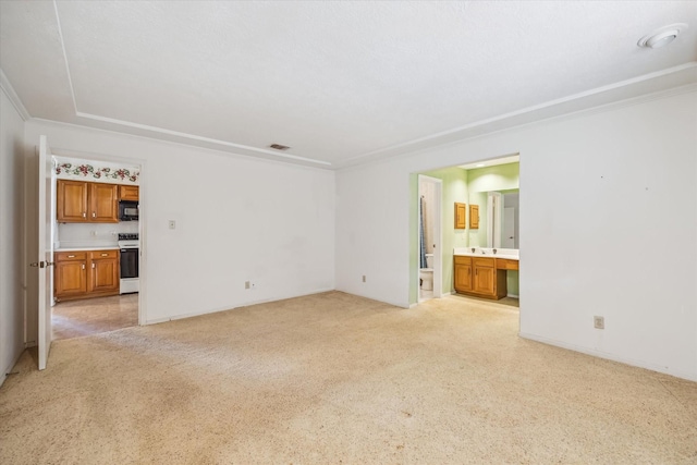 unfurnished living room featuring light colored carpet, visible vents, and ornamental molding