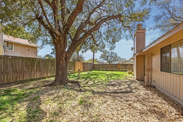 view of yard featuring a fenced backyard