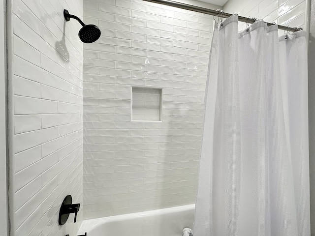 bathroom featuring shower / bath combo with shower curtain