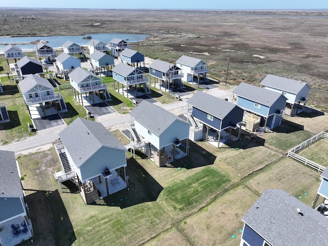 aerial view with a residential view and a water view