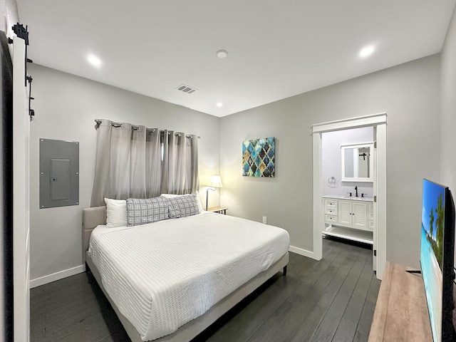 bedroom featuring visible vents, electric panel, a sink, dark wood-style floors, and baseboards