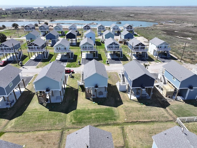 bird's eye view with a residential view and a water view