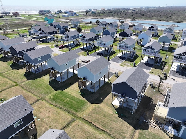 aerial view with a residential view and a water view